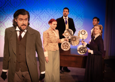 The cast of Ada and the Engine by Lauren Gunderson, produced by Theatre Unleashed at studio/stage, featuring Gregory Crafts as Lord Lovelace (upper right)