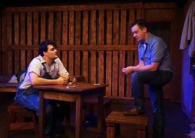 Actor Gregory Crafts as Lennie Small and Spencer Cantrell as George Milton in John Steinbeck's "Of Mice and Men" at Theatre Unleashed, directed by Aaron Lyons