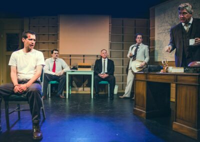A scene from "Sunny Afternoon" by Christian Levatino, featuring Gregory Crafts as Det. Richard "Dick" Simms and Andy Hirsch as Lee Harvey Oswald, Darrett Sanders as Capt. Will Fritz, Spencer Cantrell as Assistant District Attorney Bill Alexander and Jeff Doba as SSA Forrest Sorrels, Part I of the Black Bag Pentalogy, presented as part of The Big Event at The Complex Hollywood